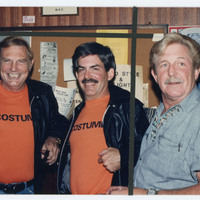 Three men posing for photo
