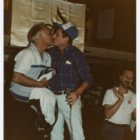Two men kissing
